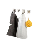 Bathroom towels and sponge on hooks.
