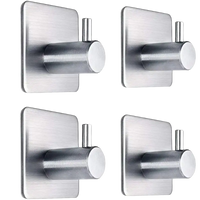 Four brushed metal adhesive hooks.