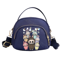 Navy blue cartoon-printed handbag.