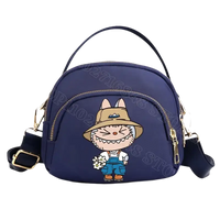 Navy blue cartoon character handbag.