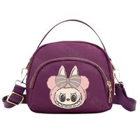 Purple nylon handbag with cartoon bunny.
