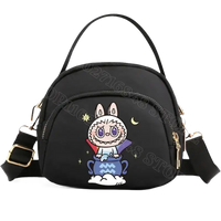 Black cartoon-decorated handbag.