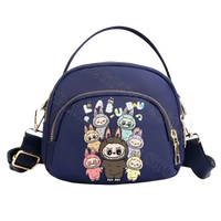 Navy blue cartoon-themed handbag.