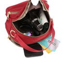 Red nylon handbag with contents.