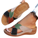 Women’s leaf-accented slide sandals.