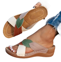Leaf-accented, multi-colored women’s sandals.
