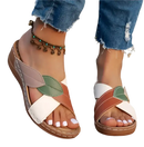 Leaf-accented crisscross sandals.