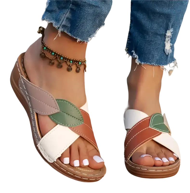 Leaf-accented crisscross sandals.