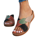 Leaf-accented crisscross sandals.