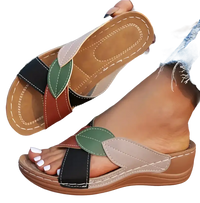 Leaf-adorned, multi-colored women’s sandals.