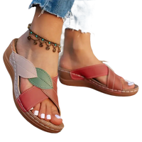 Leaf-adorned crisscross sandals.