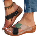 Women’s leaf-accented wedge sandals.