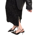 Black patent leather slingback heels.