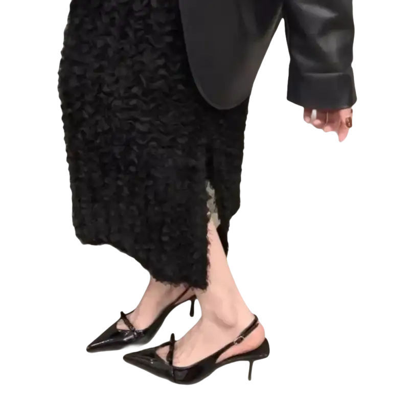 Black patent leather slingback heels.