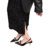 Black patent leather slingback heels.