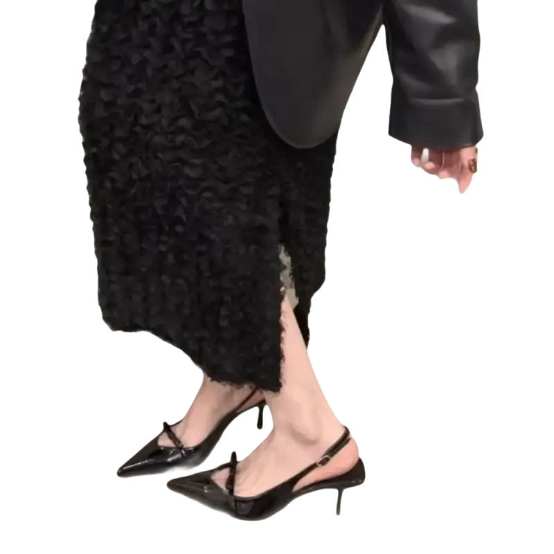 Black patent leather slingback heels.