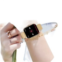 Gold smartwatch with music controls.