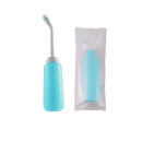 Turquoise portable bidet with angled nozzle.