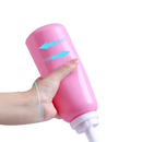 Pink squeezable bottle.