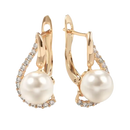 Gold-tone pearl drop earrings.