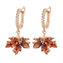 Pair of rose gold maple leaf earrings.