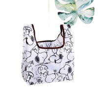 White Snoopy-patterned tote bag.