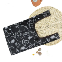 Black Snoopy-patterned reusable shopping bag.