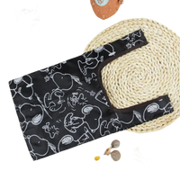 Black Snoopy-patterned foldable shopping bag.