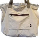 Beige tote bag with Peanuts trim.