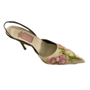 Floral embroidered slingback heel.
