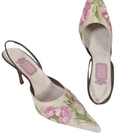 Floral embroidered slingback heels.