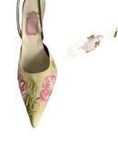 Floral embroidered pointed-toe slingback heels.