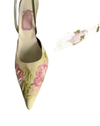 Floral embroidered pointed-toe slingback heels.