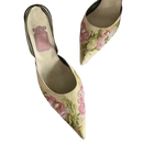 Floral embroidered pointed-toe heels.