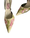 Floral embroidered pointed-toe slingback heels.