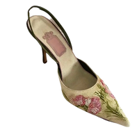 Floral embroidered slingback heel.