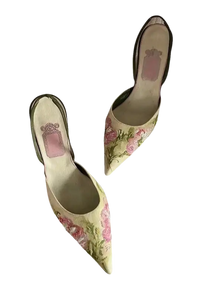Floral embroidered slingback heels.