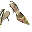 Floral embroidered slingback heels.