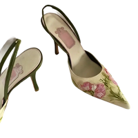 Floral embroidered slingback heels.