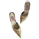 Floral embroidered slingback heels.