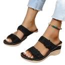 Black floral wedge sandals.