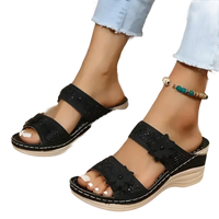 Black floral wedge sandals.