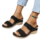 Black floral wedge sandals.