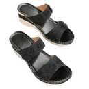 Black floral embellished wedge sandals.