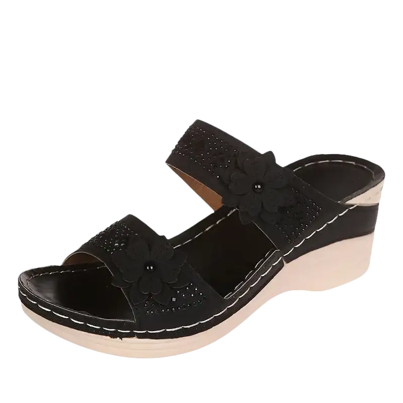 Black floral wedge sandal.