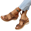 Brown floral-accented wedge sandals.