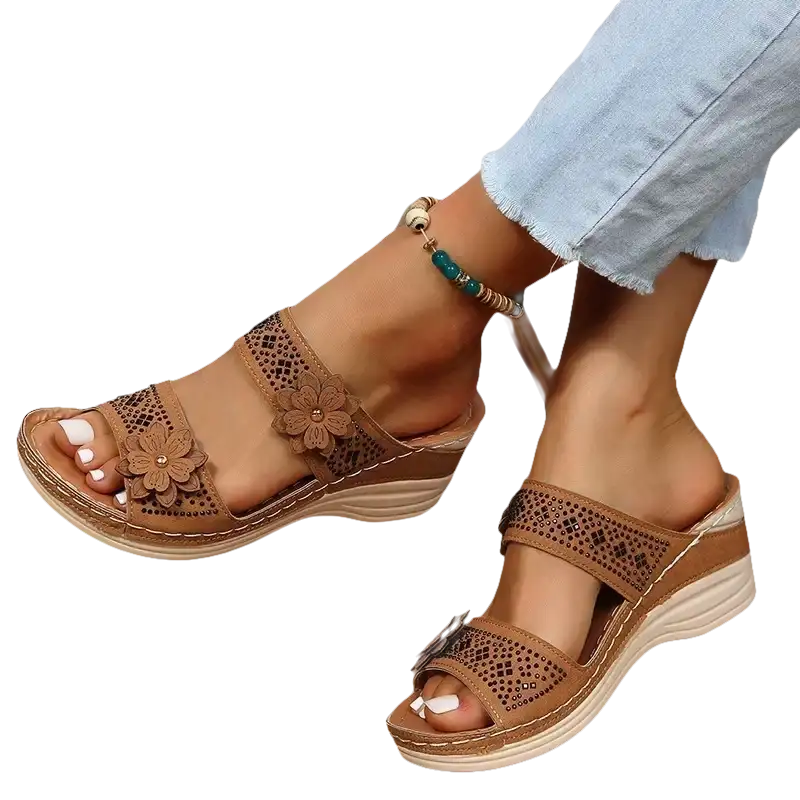 Brown floral-accented wedge sandals.