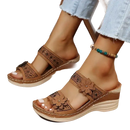 Brown floral-accented wedge sandals.
