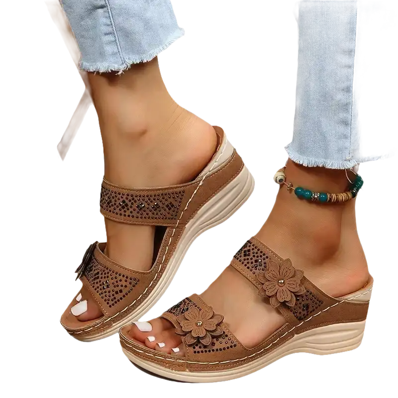 Brown floral-accented wedge sandals.
