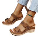 Brown floral-accented wedge sandals.
